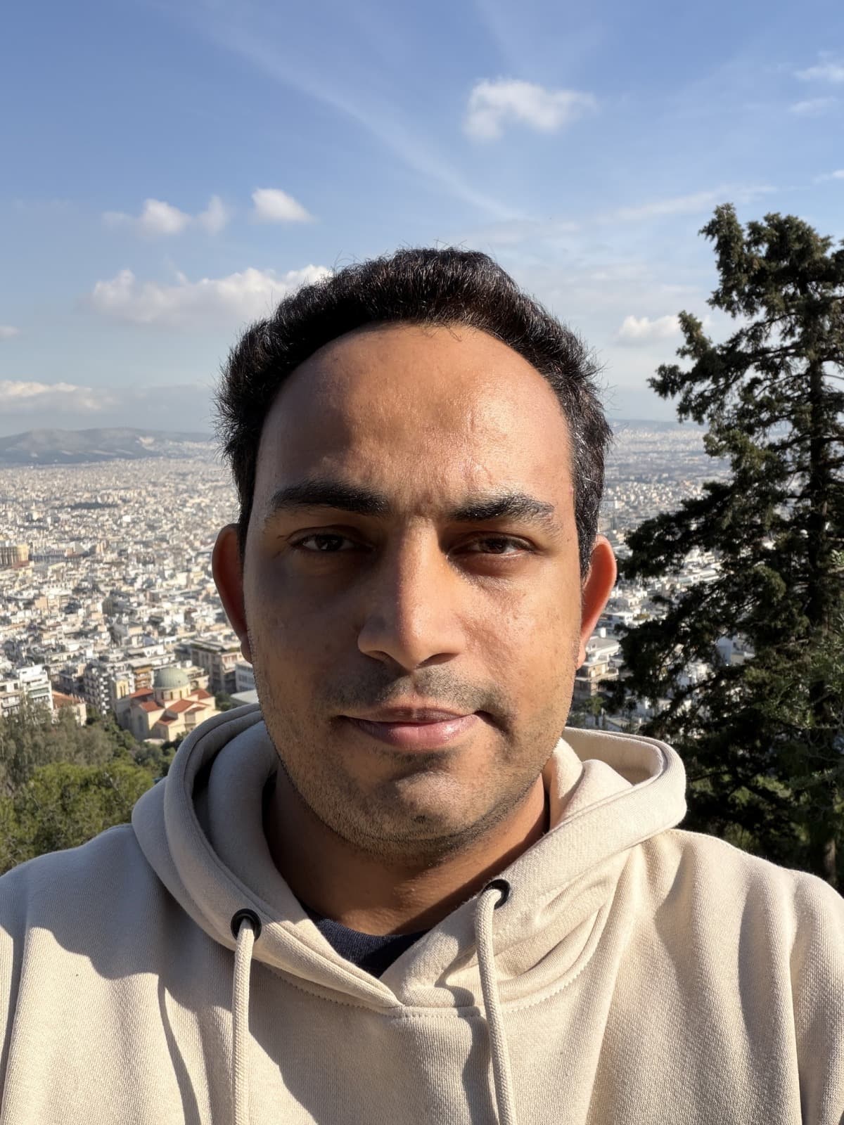 Tony above the city of Athens on a sunny day